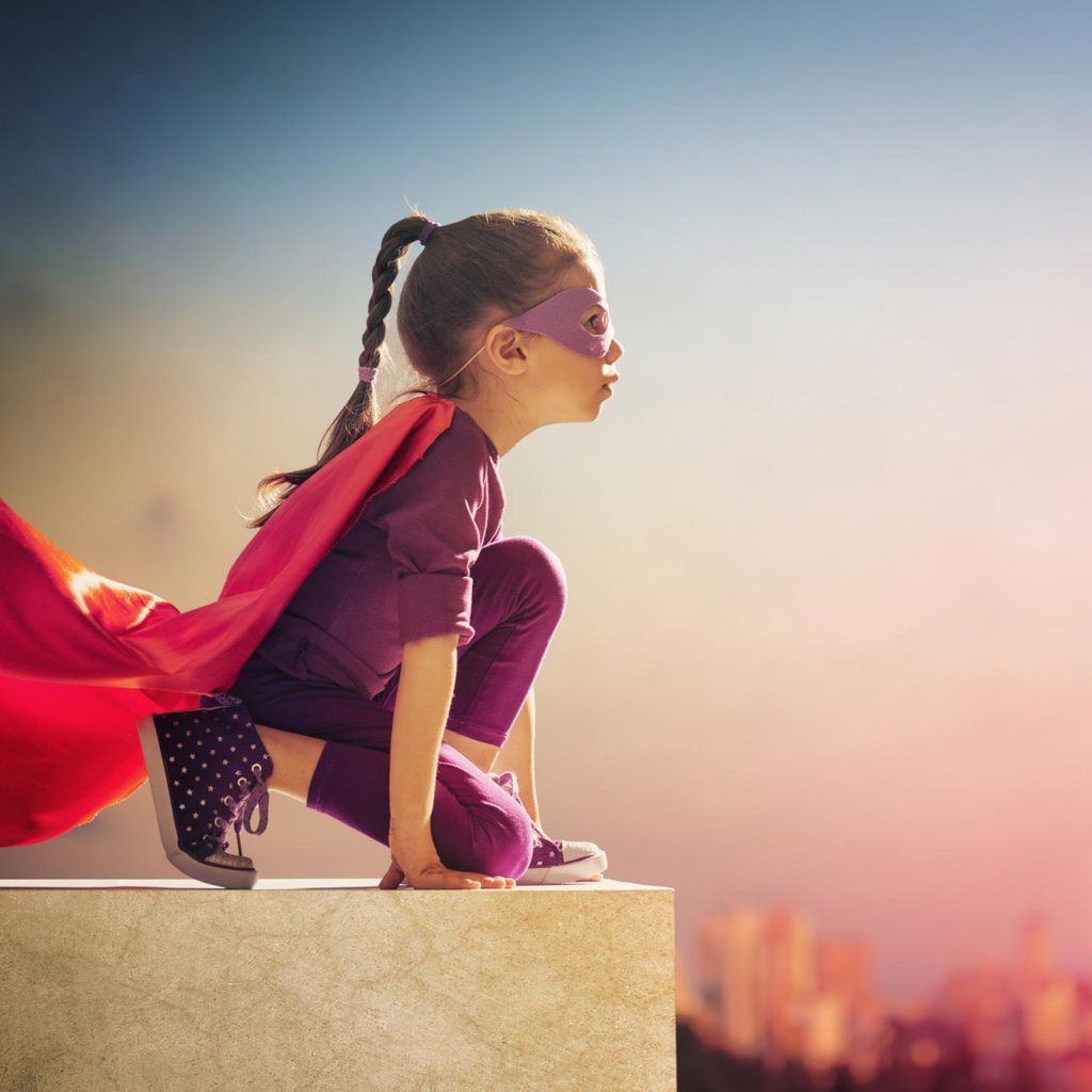 girl dressed as superhero