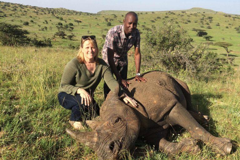 Dr. Suzan Murray with assistant and rhino