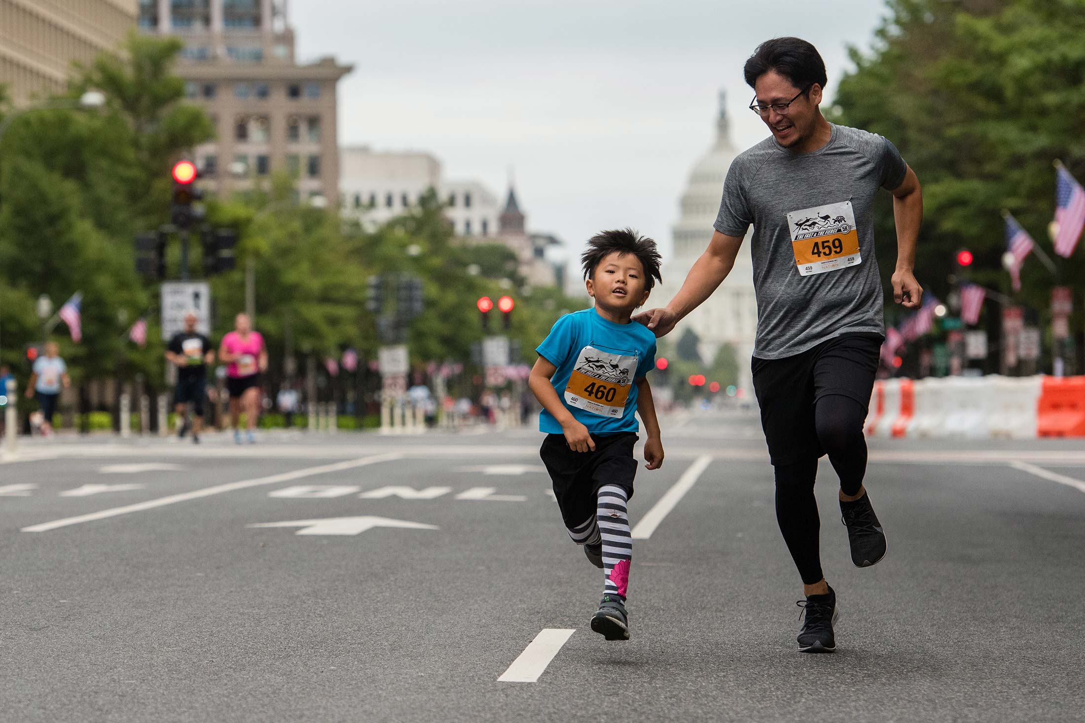 two joggers running in a 5k