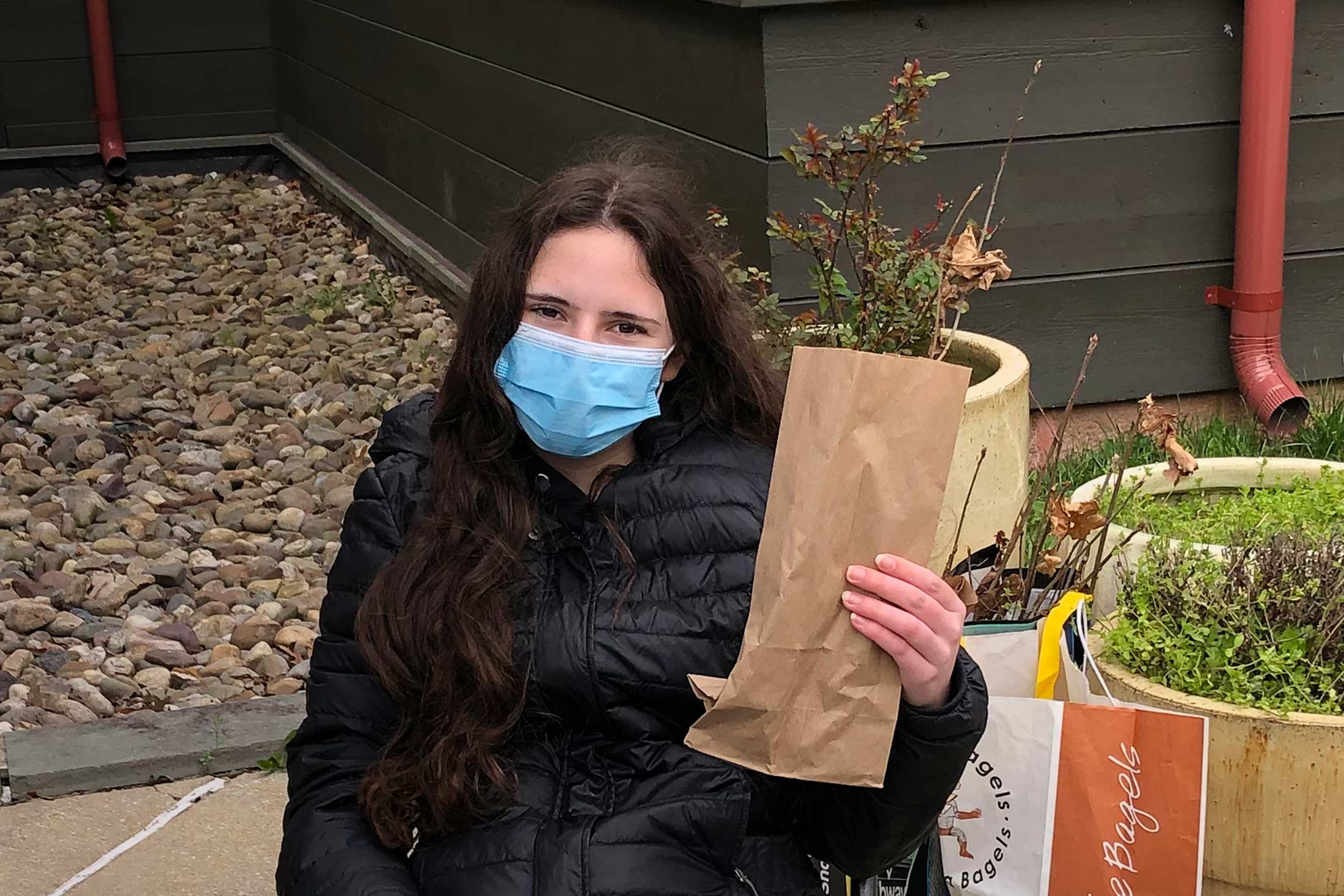 NxtGen Conservationist Allie holding a black oak seedling