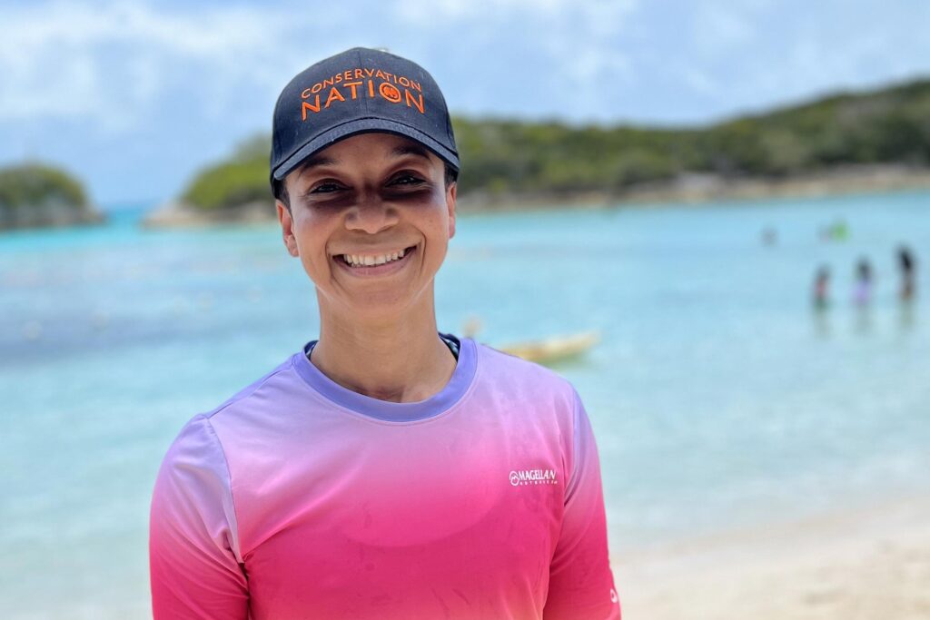 Conservation Nation's T'Noya Thompson standing near a lagoon in the Bahamas