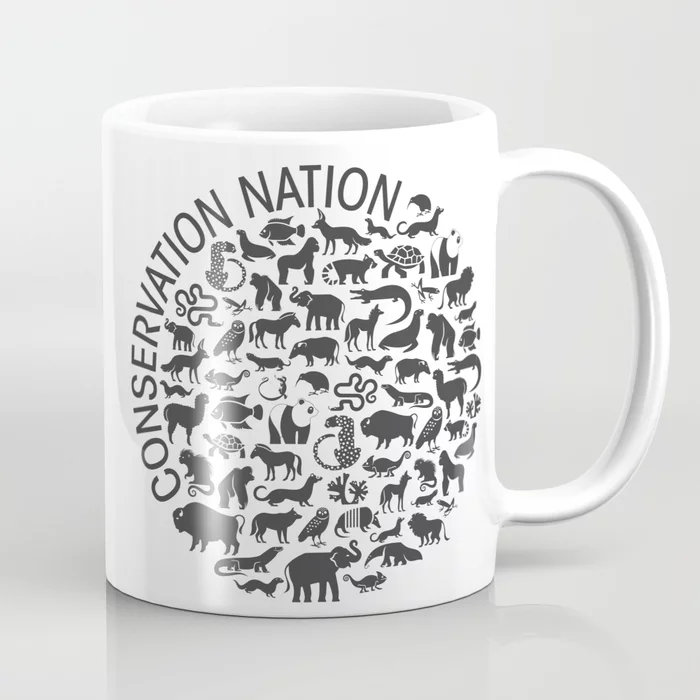 coffee mug with illustrated animals and the words conservation nation