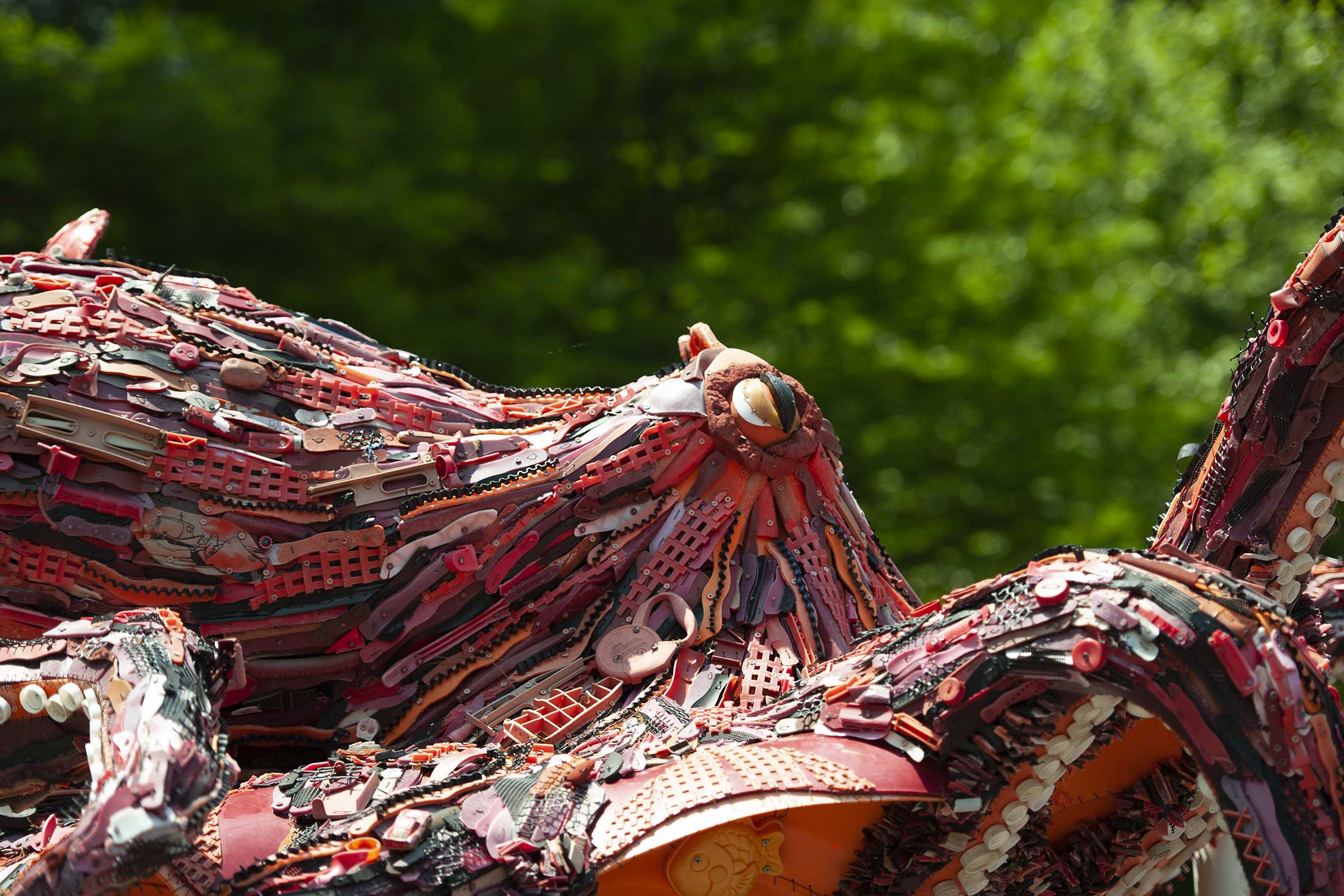 a sculpture of an octopus created by trash found on beaches