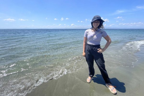 Conservation Nation grantee Fátima Ramis standing on a sandy beach